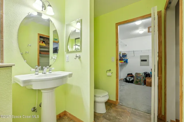 an aerial view of a house with a yard and garden