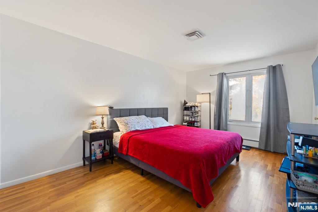 51 Anderson Avenue Englewood Cliffs, NJ 07632 - Photo 16 of 46 a bedroom with a bed and a window