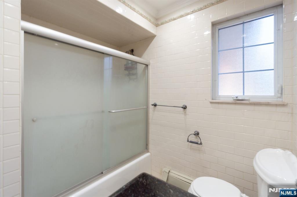 51 Anderson Avenue Englewood Cliffs, NJ 07632 - Photo 18 of 46 a bathroom with a toilet and a shower