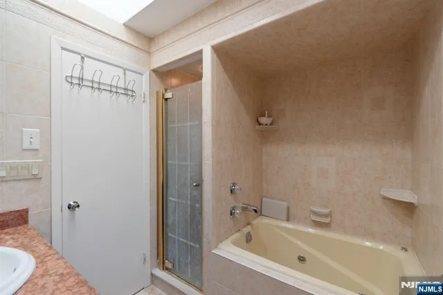 a bathroom with a bathtub and a sink