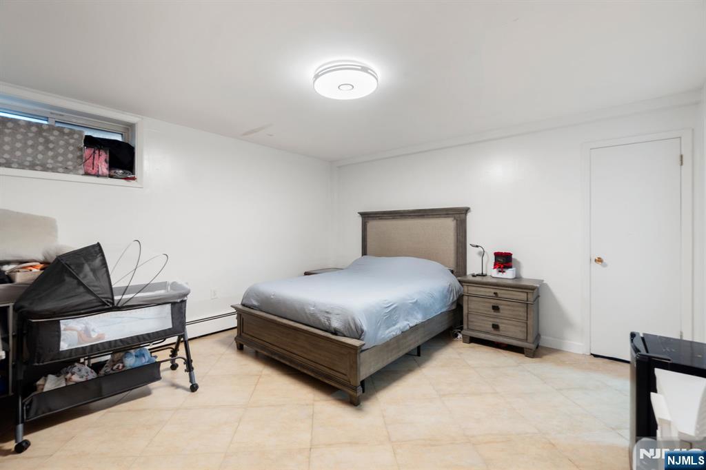 51 Anderson Avenue Englewood Cliffs, NJ 07632 - Photo 27 of 46 a bedroom with a bed and dresser