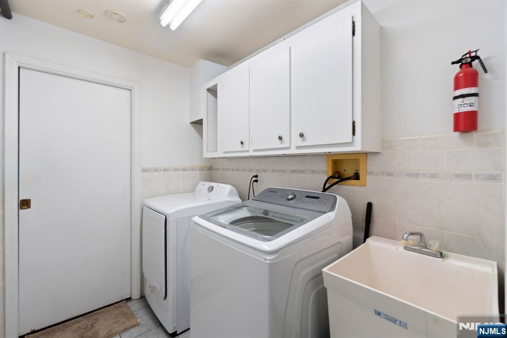 51 Anderson Avenue Englewood Cliffs, NJ 07632 - Photo 31 of 46 a view of storage and utility room with washer and dryer