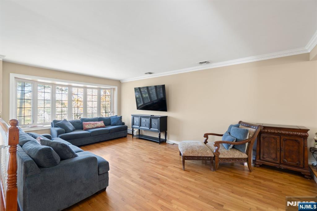 51 Anderson Avenue Englewood Cliffs, NJ 07632 - Photo 4 of 46 a living room with furniture and a flat screen tv