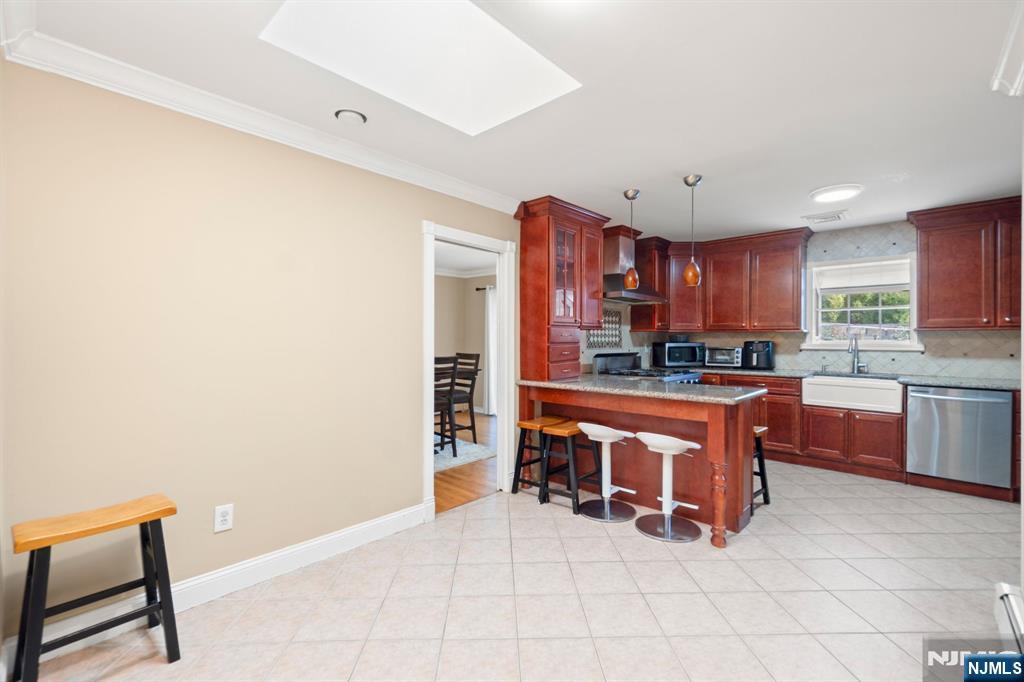 51 Anderson Avenue Englewood Cliffs, NJ 07632 - Photo 10 of 46 a large kitchen with stainless steel appliances a refrigerator and a stove top oven
