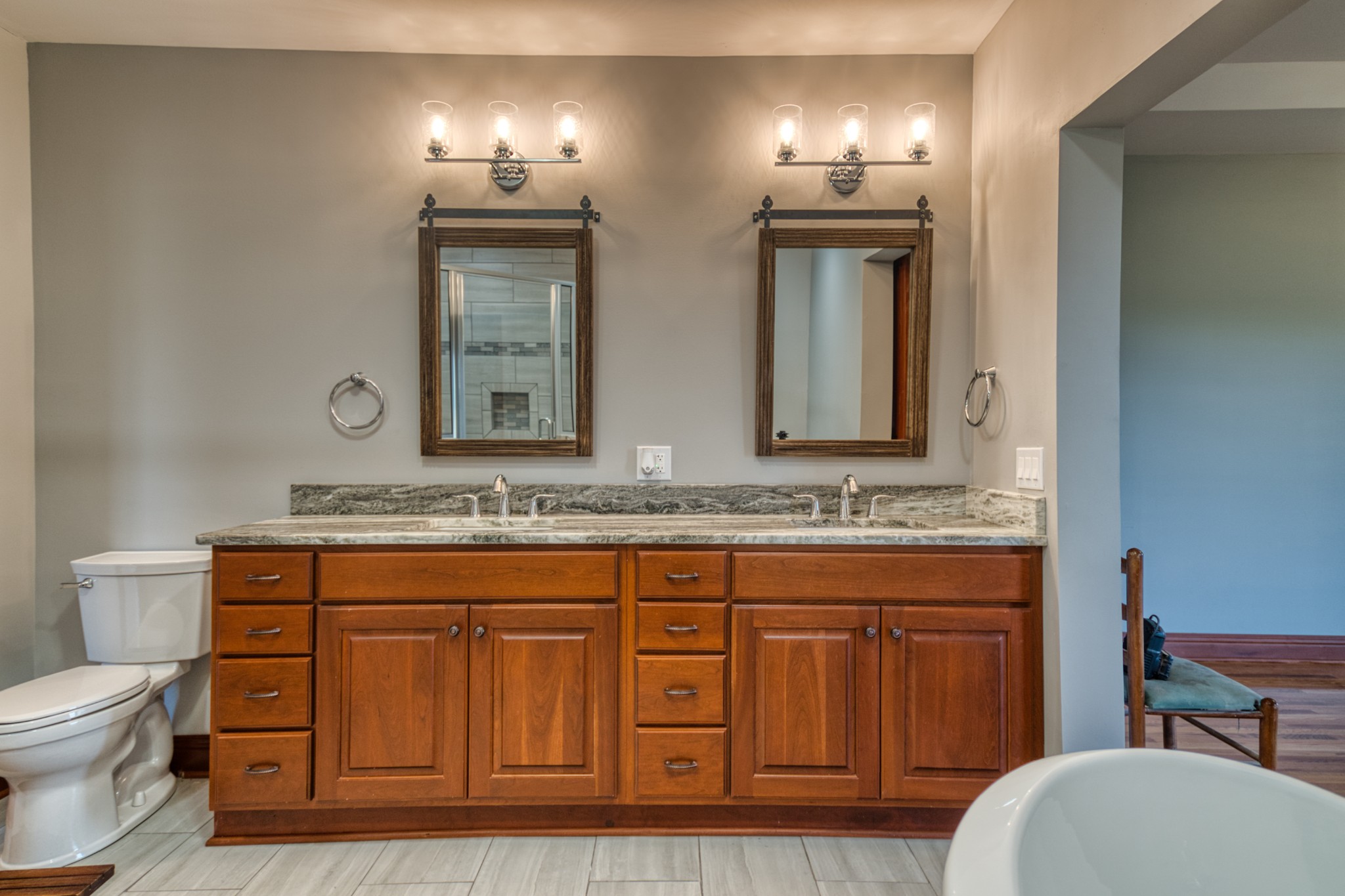 315 Blue And Gray Park Road Elkton, KY 42220 - Photo 43 of 66 a bathroom with a granite countertop toilet sink and mirror