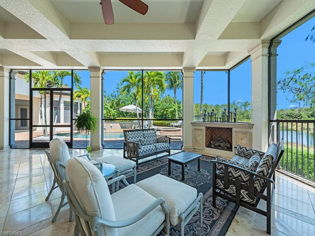 29115 Teramo Way Naples, FL 34110 - Photo 26 of 49 Expansive covered lanai w/ fireplace