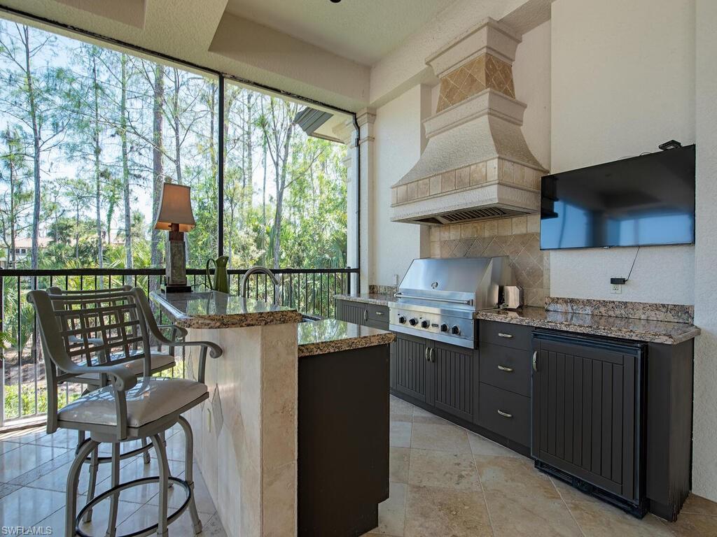 29115 Teramo Way Naples, FL 34110 - Photo 27 of 49 Expansive covered lanai w/ summer kitchen
