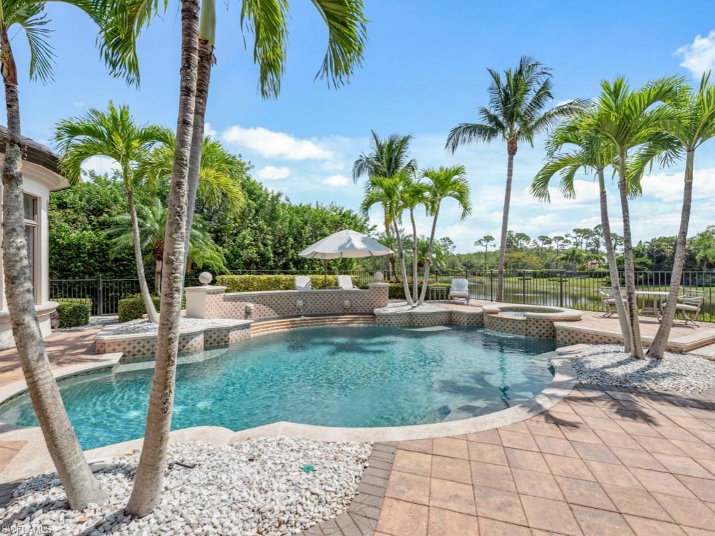 29115 Teramo Way Naples, FL 34110 - Photo 28 of 49 View of swimming sundeck & pool with an integrated spillover spa and fountain