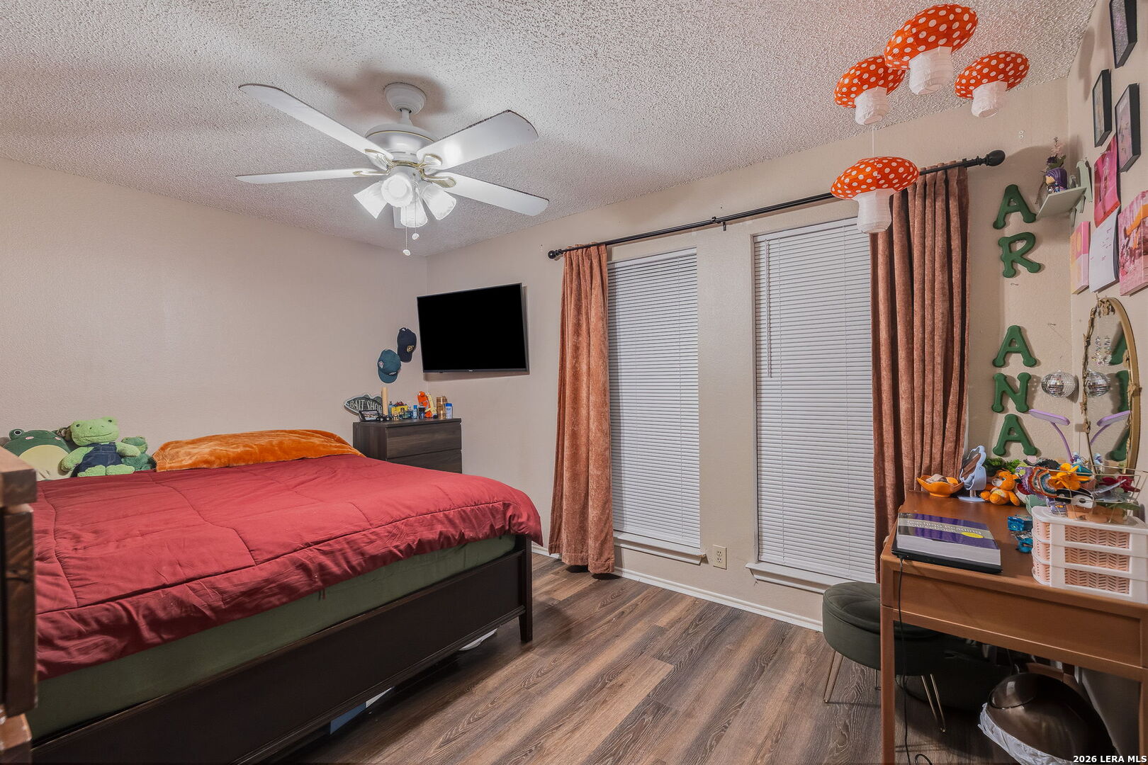 9140 Timber Path, Unit 2502 San Antonio, TX 78250 - Photo 14 of 26 a bedroom with a bed and a flat tv screen on dresser