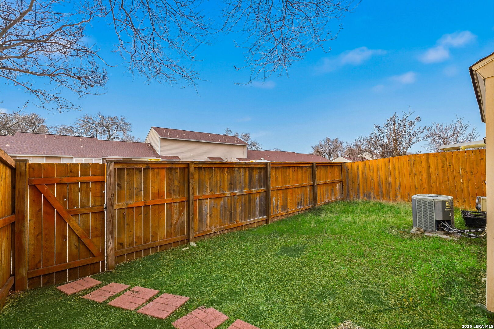 9140 Timber Path, Unit 2502 San Antonio, TX 78250 - Photo 17 of 26 a backyard of a house with lawn chairs