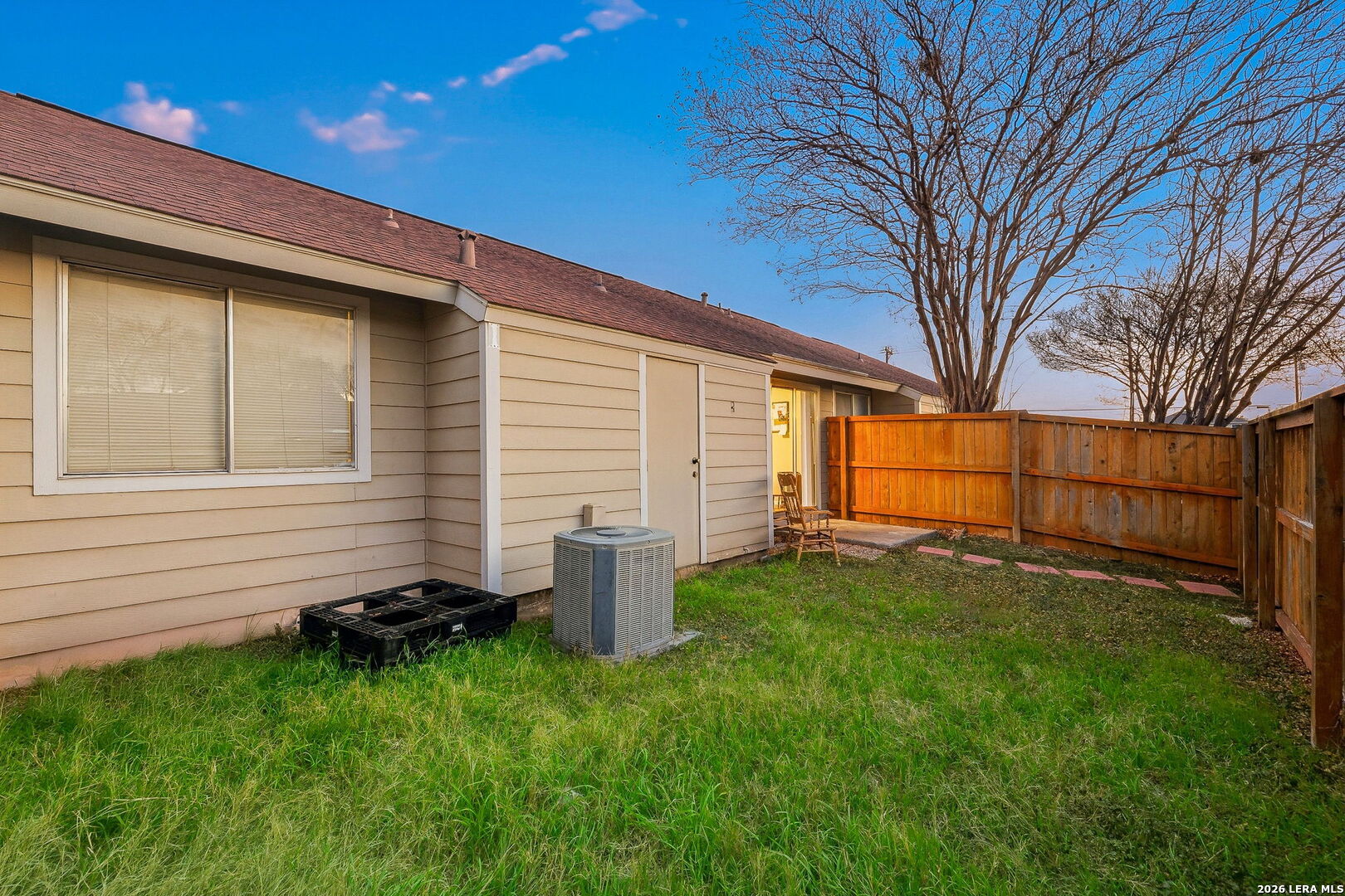 9140 Timber Path, Unit 2502 San Antonio, TX 78250 - Photo 19 of 26 a backyard of a house with lots of green space