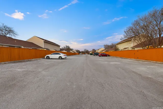 a view of an outdoor space and basketball court