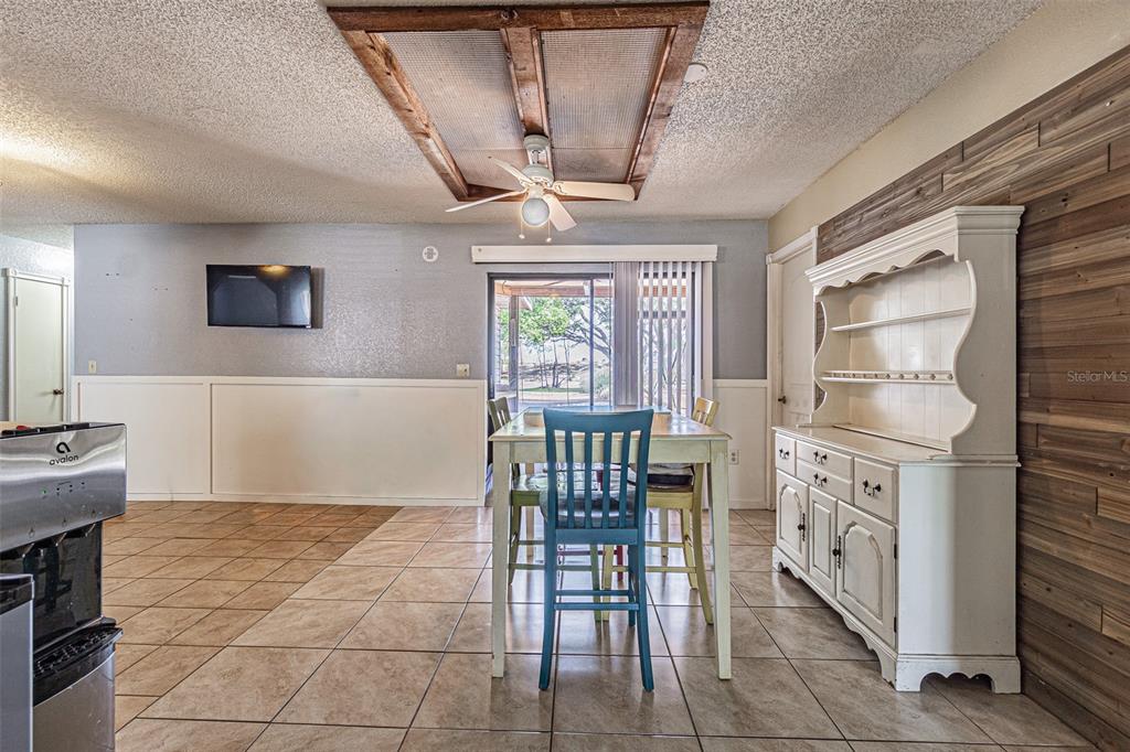 17851 Oxenham Avenue Spring Hill, FL 34610 - Photo 13 of 31 a kitchen with furniture a window and stainless steel appliances