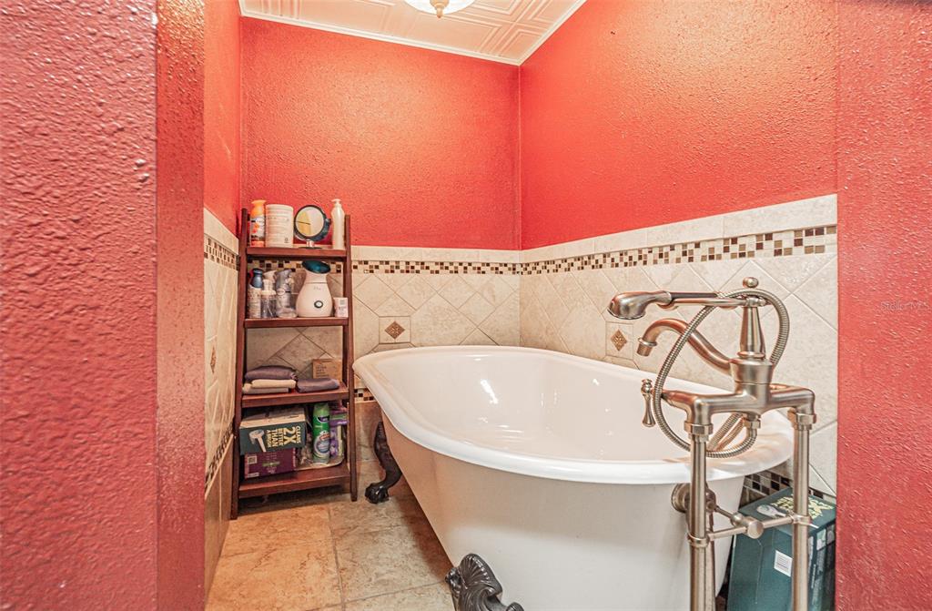 17851 Oxenham Avenue Spring Hill, FL 34610 - Photo 20 of 31 a bathroom with a bathtub and shower