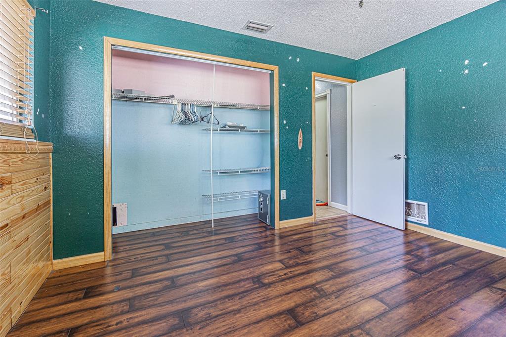17851 Oxenham Avenue Spring Hill, FL 34610 - Photo 22 of 31 a view of empty room with wooden floor