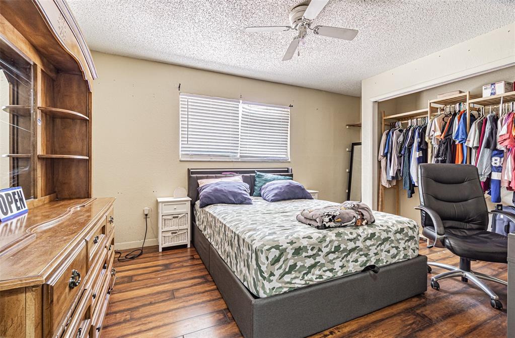 17851 Oxenham Avenue Spring Hill, FL 34610 - Photo 26 of 31 a bedroom with a bed and a couch