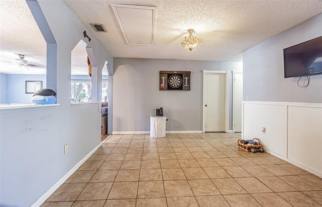 17851 Oxenham Avenue Spring Hill, FL 34610 - Photo 28 of 31 a view of a livingroom with an empty space and a window