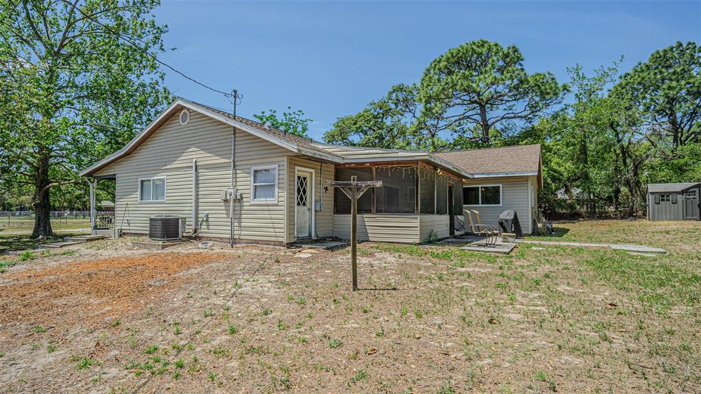 17851 Oxenham Avenue Spring Hill, FL 34610 - Photo 29 of 31 a view of a house with a yard and tree
