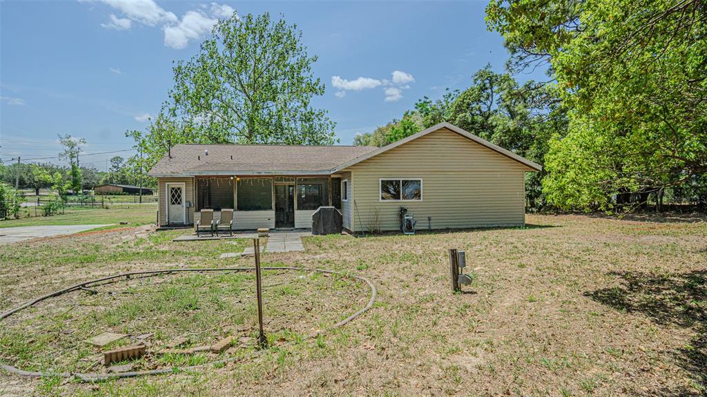 17851 Oxenham Avenue Spring Hill, FL 34610 - Photo 31 of 31 a view of a house with a yard