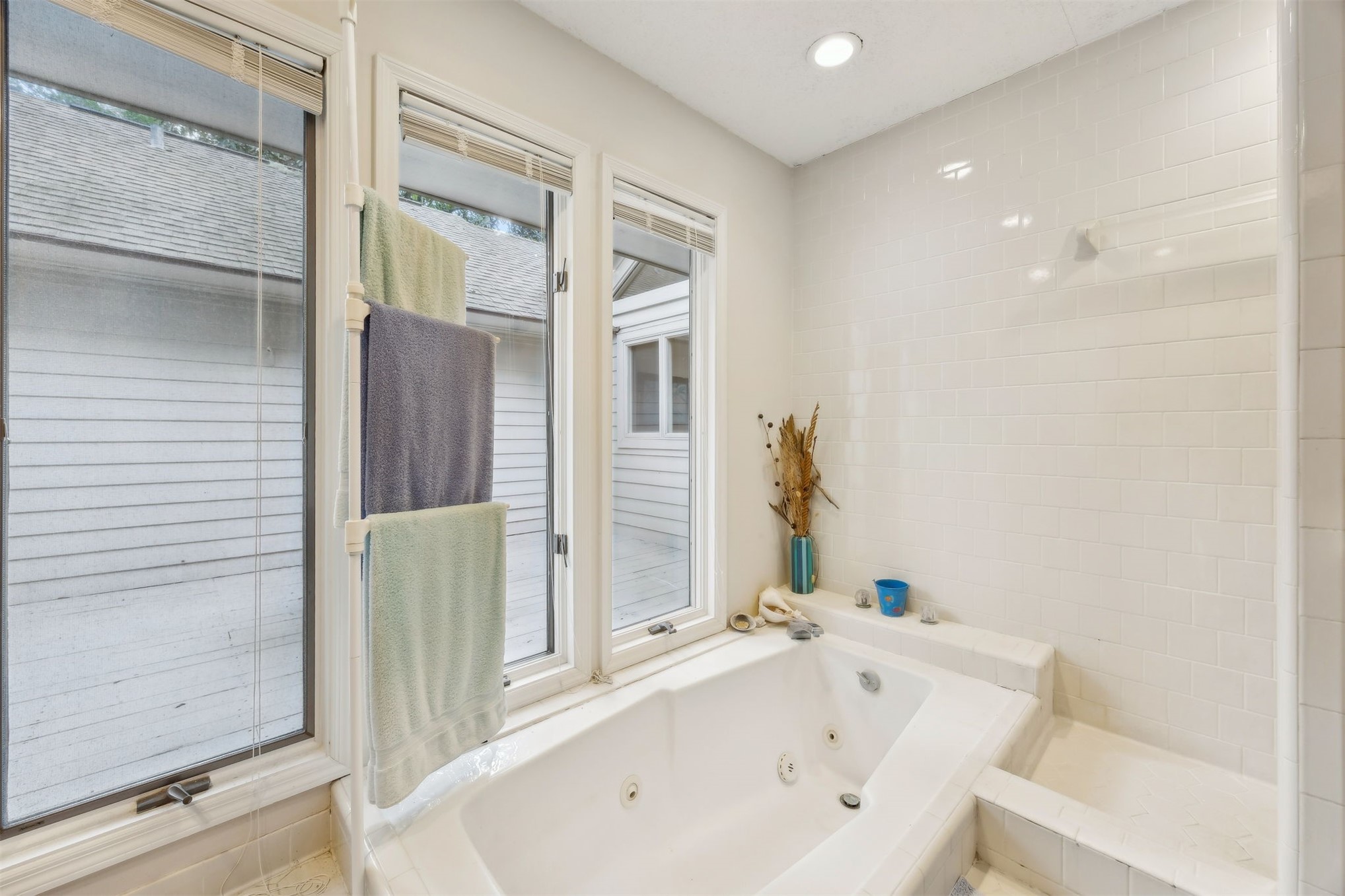 59 Laurel Oak Road Fernandina Beach, FL 32034 - Photo 16 of 54 a bathroom with a bathtub and a shower