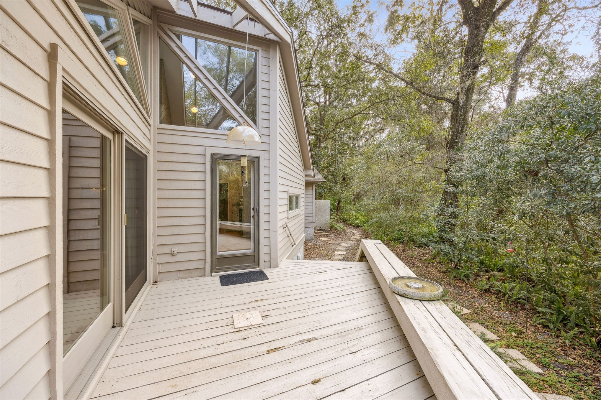 59 Laurel Oak Road Fernandina Beach, FL 32034 - Photo 23 of 54 a view of a balcony with wooden floor and iron stairs