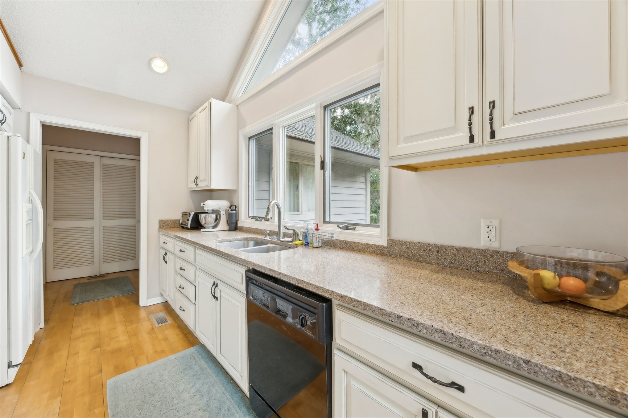 59 Laurel Oak Road Fernandina Beach, FL 32034 - Photo 9 of 54 a spacious bathroom with a granite countertop sink and a window