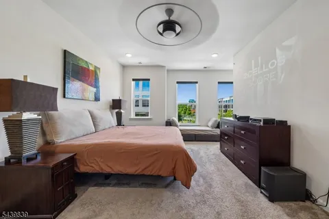 a spacious bedroom with a bed and window