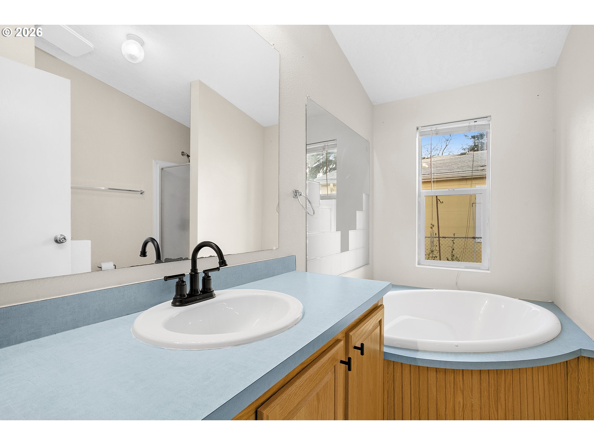 5517 Southeast Lexington Street Portland, OR 97206 - Photo 18 of 29 a bathroom with a sink and a mirror