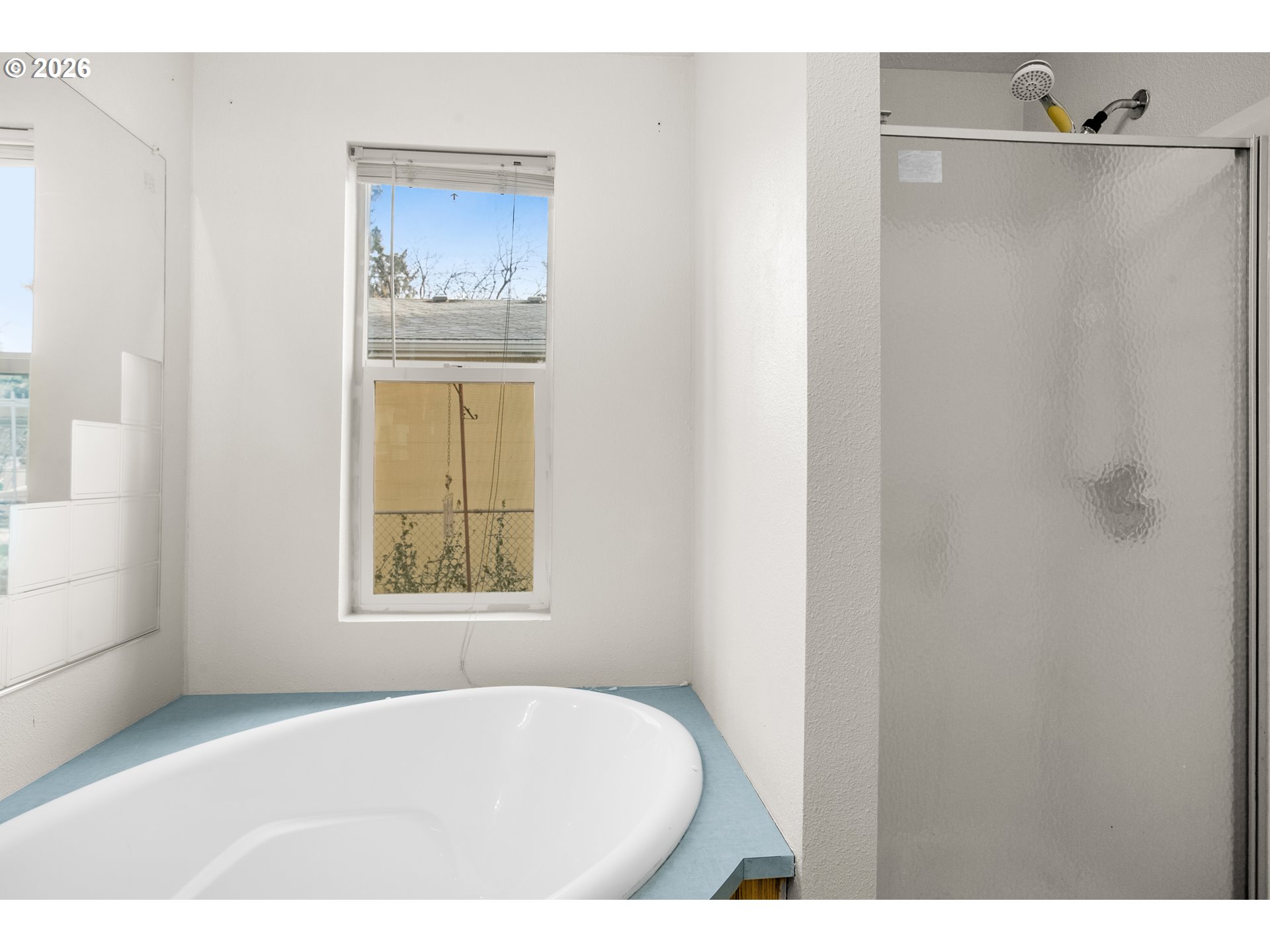 5517 Southeast Lexington Street Portland, OR 97206 - Photo 19 of 29 a bathroom with a bathtub and shower