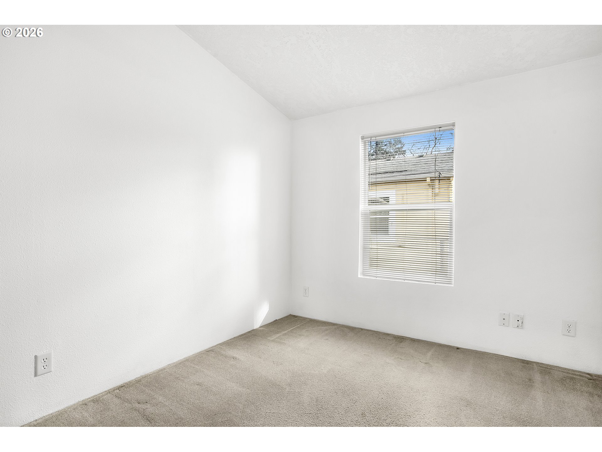 5517 Southeast Lexington Street Portland, OR 97206 - Photo 20 of 29 an empty room with a window