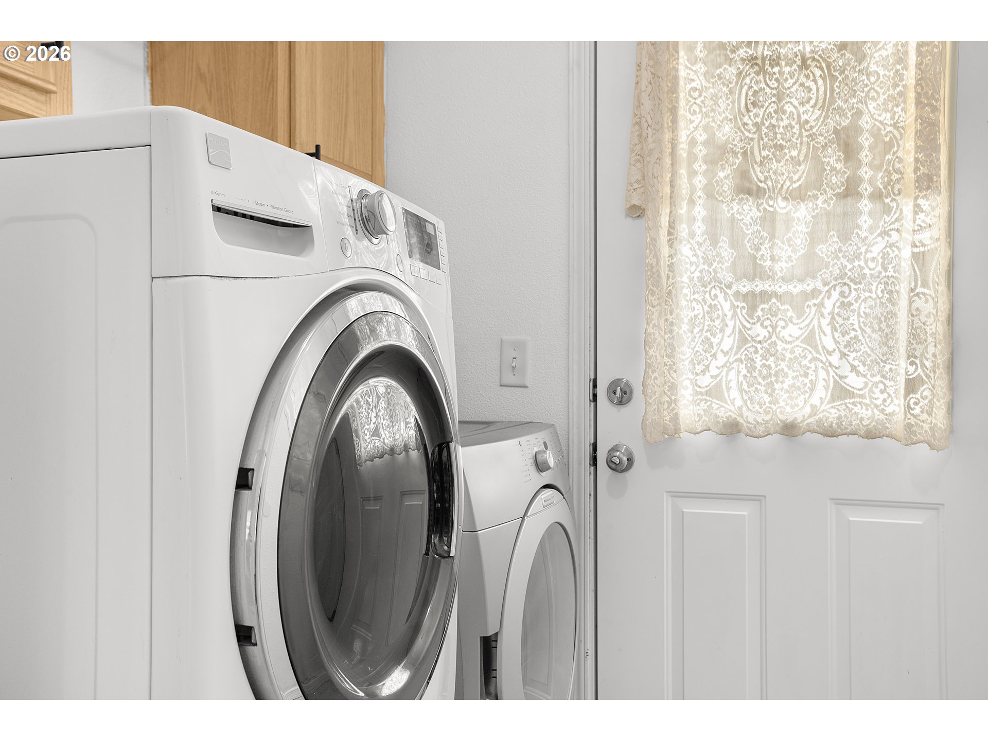 5517 Southeast Lexington Street Portland, OR 97206 - Photo 23 of 29 a view of a kitchen with washer and dryer