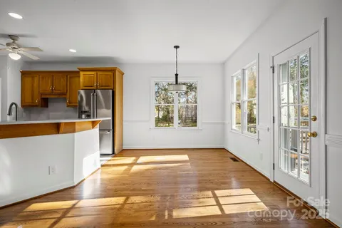 a view of a bathroom with tub and window