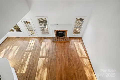 a workspace with furniture window and wooden floor