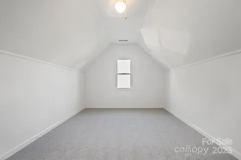 a view of street with wooden fence