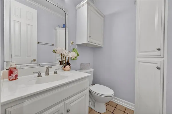 a bathroom with a sink toilet and vanity