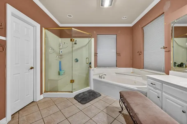 a bathroom with a tub shower and sink