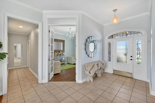 a view of a hallway view with wooden floor and dining room view