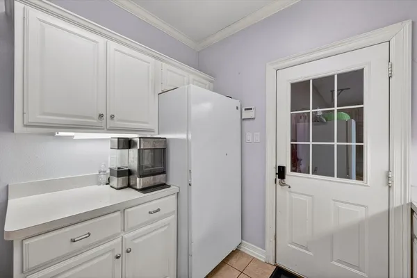 a kitchen with stainless steel appliances white cabinets and a sink