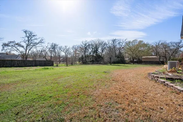 a view of a field with sitting area