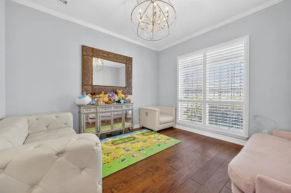 a living room with furniture and a table