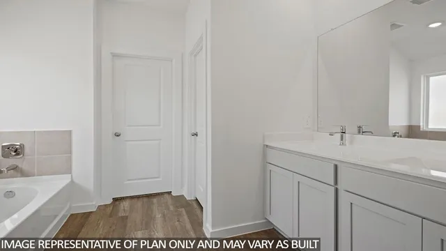 a bathroom with a sink a toilet and bathtub