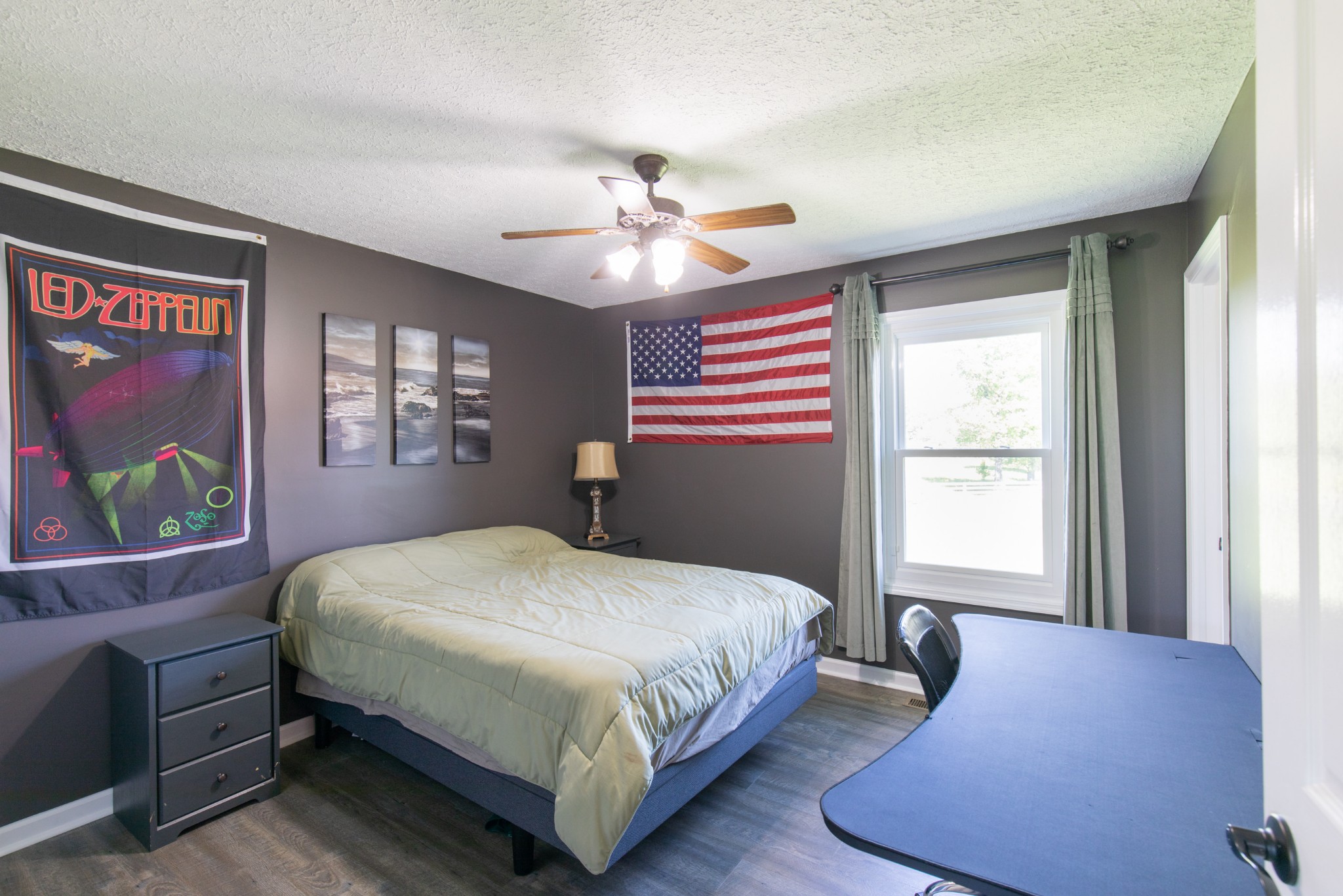 6022 Wayman Dunn Road Springfield, TN 37172 - Photo 25 of 35 a bedroom with a bed and a chandelier