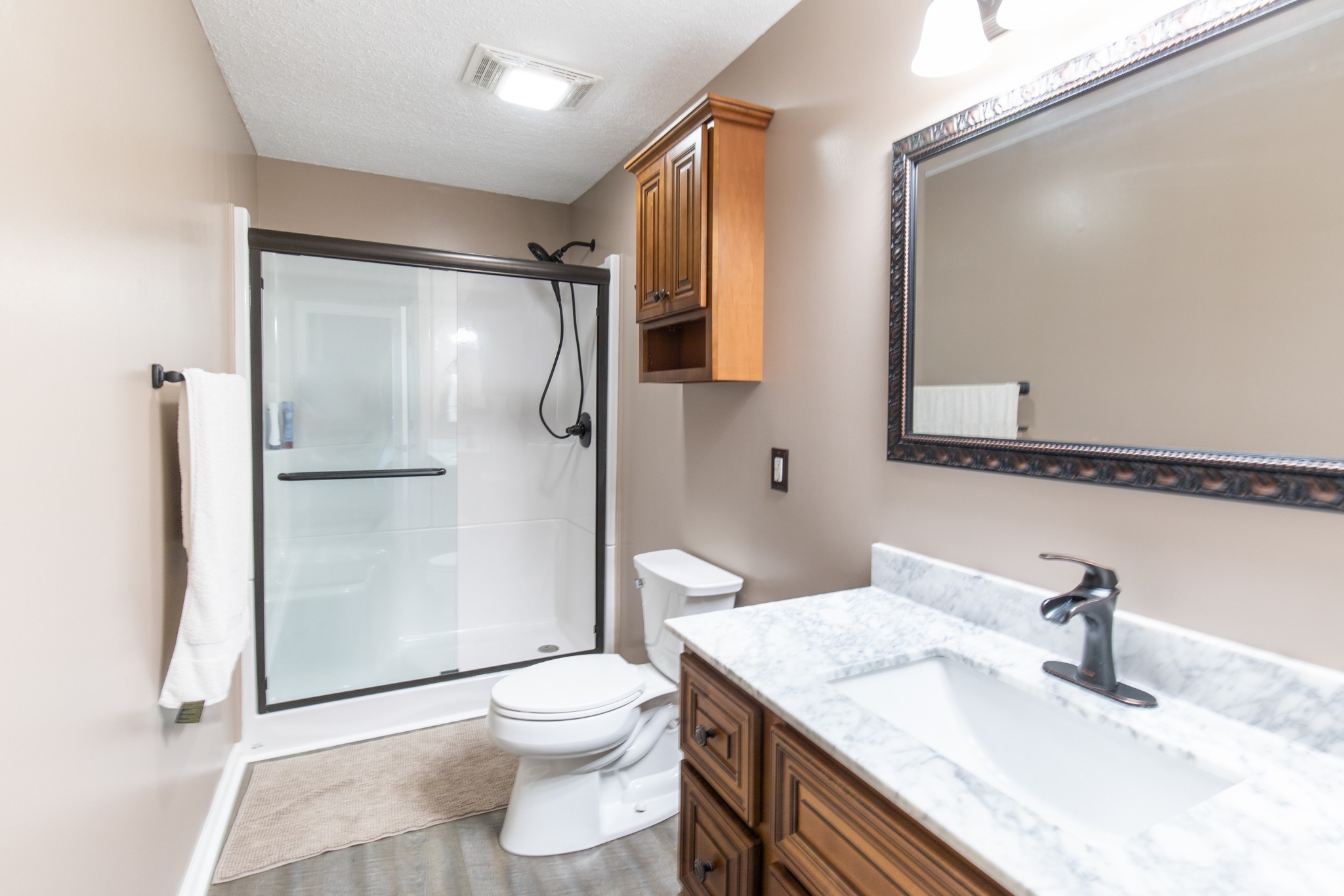 6022 Wayman Dunn Road Springfield, TN 37172 - Photo 27 of 35 a bathroom with a granite countertop sink toilet and shower