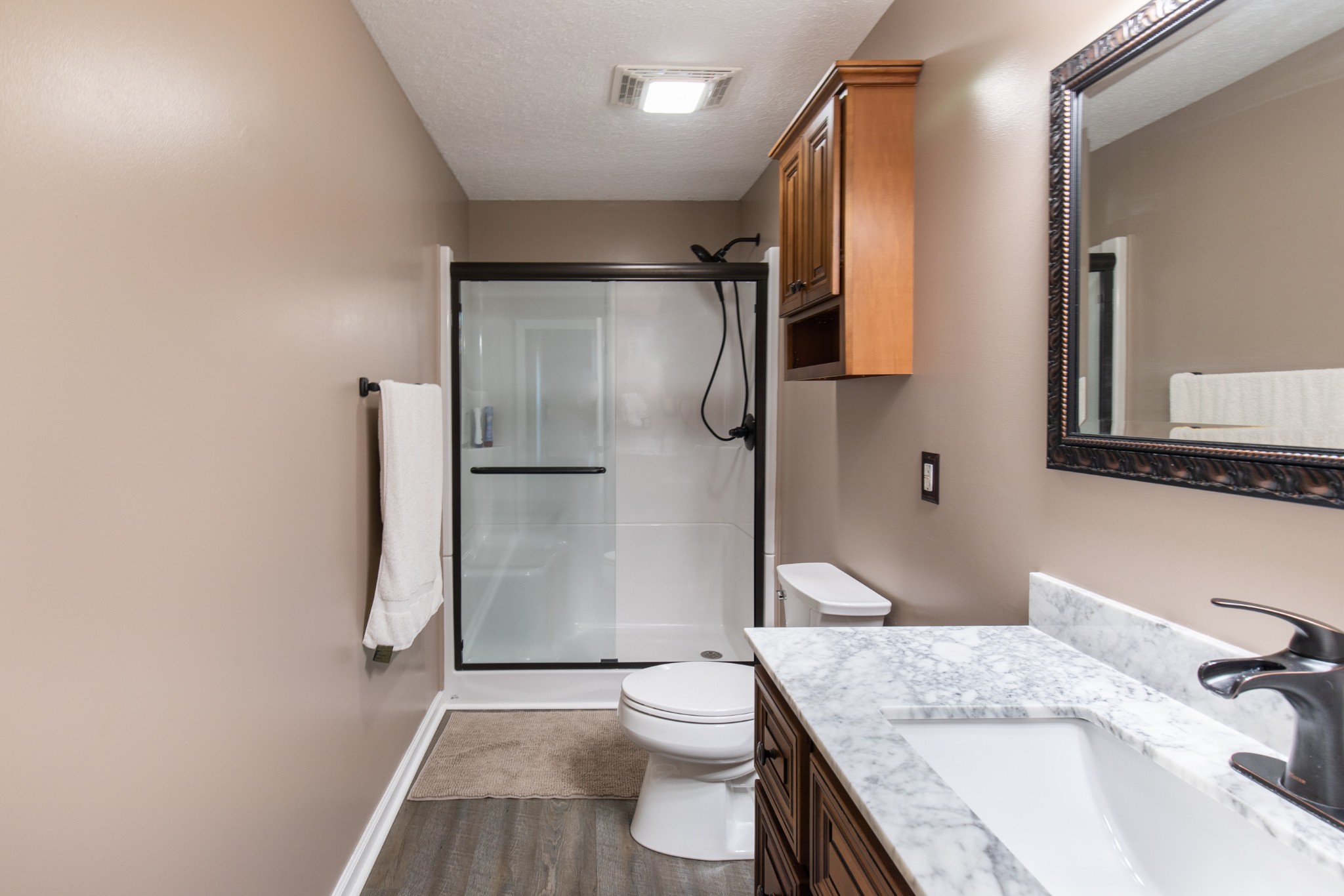 6022 Wayman Dunn Road Springfield, TN 37172 - Photo 28 of 35 a bathroom with a granite countertop sink toilet and shower