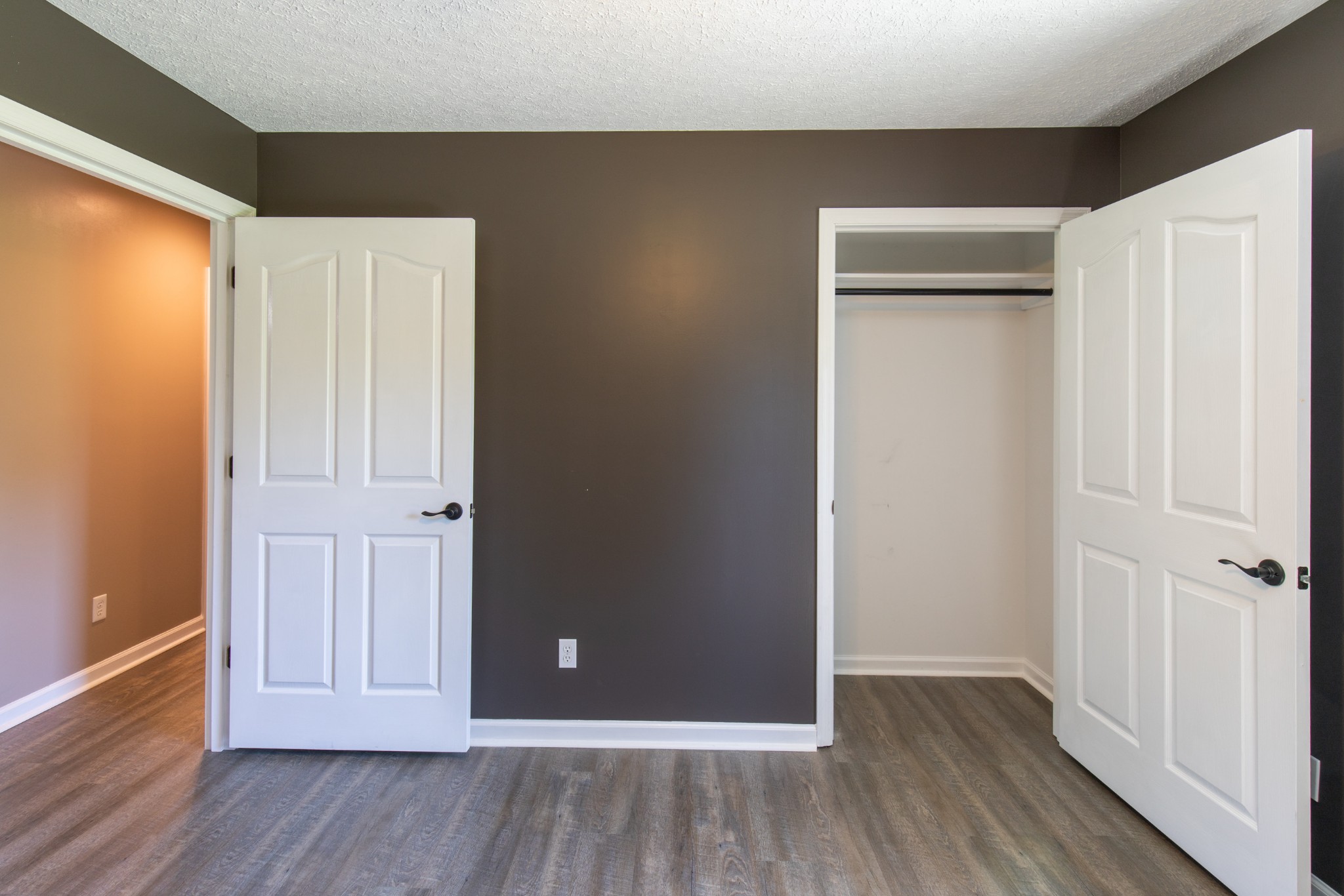 6022 Wayman Dunn Road Springfield, TN 37172 - Photo 31 of 35 an empty room with wooden floor and closet area