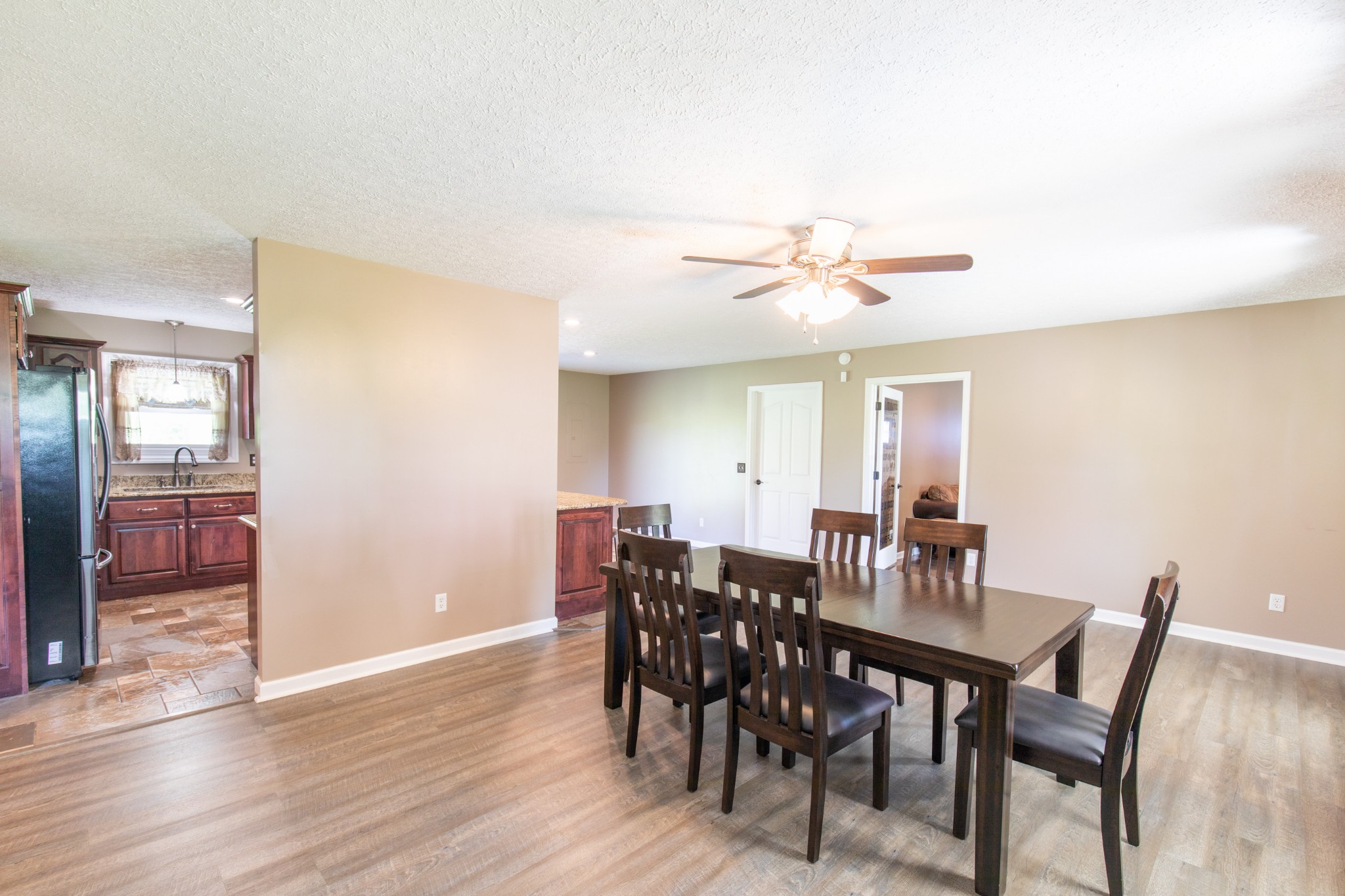 6022 Wayman Dunn Road Springfield, TN 37172 - Photo 7 of 35 a view of a dining room with furniture and wooden floor