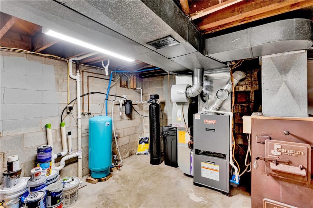 6096 Kemerer Hollow Road Export, PA 15632 - Photo 34 of 47 Plenty of storage in the lower level utility room. Additional heat source with the wood burning fireplace. New water purification system and Pex plumbing installed
