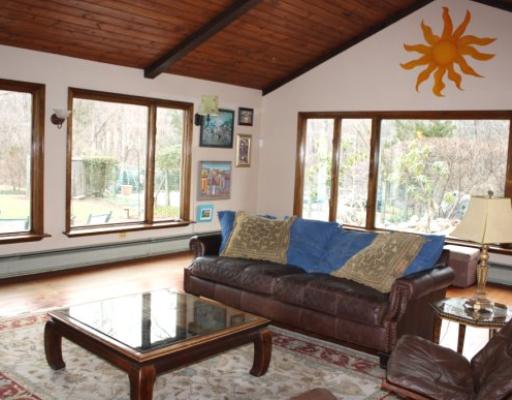 511 Green Bush Road Warwick, RI 02818 - Photo 6 of 12 Den/Family/Great Room. Cathedral ceiling family room with panoramic views of the lush yard, Koi pond and in-ground pool, through wall to wall windows. A wonderful room for friends to gather and enjoy the scenery.
