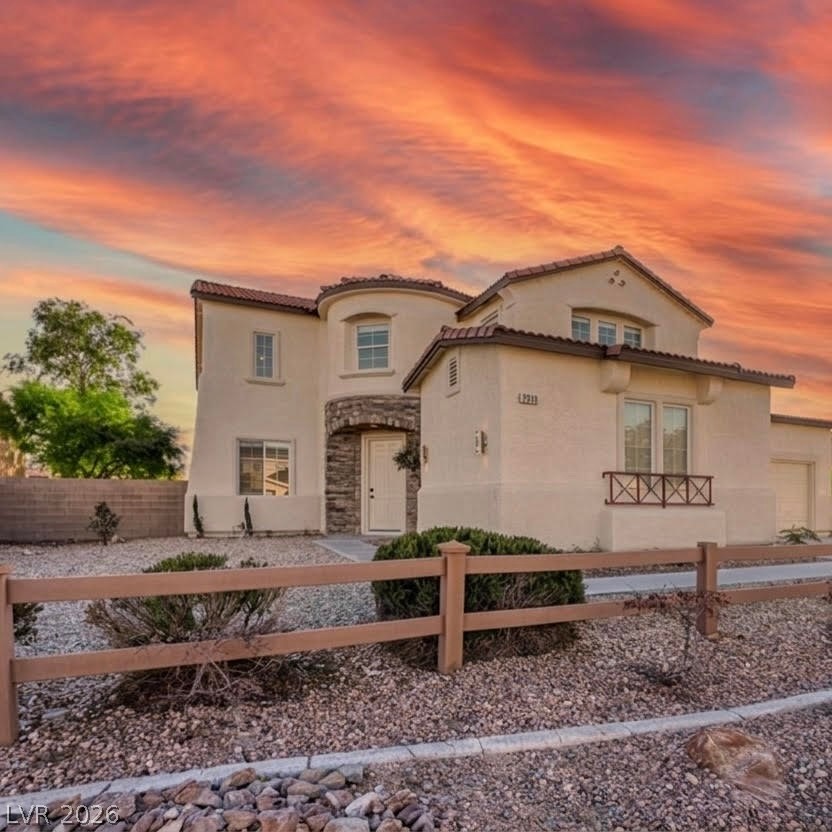 7511 Shadow Estates Way Las Vegas, NV 89113 - Photo 1 of 94 This residence showcases a Mediterranean architectural style with a warm exterior under a vibrant sky.