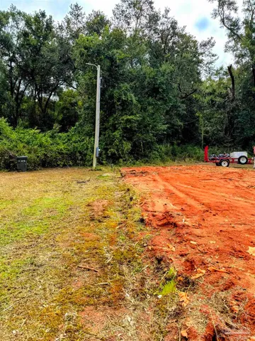 a view of a pool with a yard
